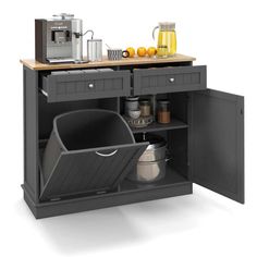 an open cabinet with pots and pans in it on top of a wooden counter