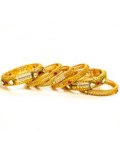 Buy Indian Kada bangles online! Ladies' gold bangle jewelry near me. Ruby bangle design with Kundans on gold bangles. Various Traditional gold bangle designs are available. Indian bridal jewelry made with love. Handcrafted Indian jewelry in Bay Area, San Francisco, California, USA. Now shipping worldwide! Gold Plated Bangle Bracelet For Wedding, Gold Plated Bangle For Marriage, Hand Set Gold Plated Bracelets For Weddings, White Bangle Jewelry For Marriage, Gold Bracelet Jewelry For Wedding, Wedding Gold-plated Hand-set Bracelets, Gold Bridal Sets With Stone Work For Celebration, Gold Wedding Bracelet Jewelry, Elegant Wedding Bangle Jewelry