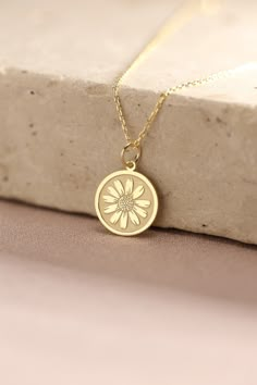 Gold Daisy Flower Pendant - Daisy Gold Necklace ● Material of pendant: Solid Gold 14k ( REAL GOLD ) ● Metal Stamp: 14k ( REAL GOLD ) ● The pendant is available in 5 sizes: - 12,7 mm / 0.5 inches (Diameter) - 14,0 mm / 0,55 inches ( Diameter ) In the photos - 15,3 mm / 0.6 inches ( Diameter ) - 16,5 mm / 0,65 inches ( Diameter ) - 19,1 mm / 0,75 inches ( Diameter ) ( In the photos the size is 14mm / 0.55 inches Diameter ) ( Jump Ring inner diameter: 4 mm ) ● Material of chain: Solid gold 14k ( RE Real Gold Necklace For Women, Gold Necklace With Engraved Flower Pendant, Charming Gold Flower Pendant Jewelry, Nature-inspired Gold Necklace With Flower Charm, Nature-inspired Gold Necklace With Flower Pendant, Gold Tarnish-resistant Flower Pendant Necklace, Gold Daisy Necklace, April Birth Flower, Fancy Jewelry Necklace