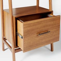 a wooden table with two drawers on one side and an open drawer on the other