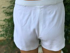 Here is a pair of vintage white polyester mans Tennis shorts . Made by Puma.Size says 36.Elastic Waist Measures 36”.Front has a pocket on each side.Left leg has a blue circle design.Shorts zips and hook.Nice vintage condition.Please take special note of measurements. 1970s sizing was much smaller than today’s standards. Please email me first if you live overseas for shipping cost. Price quoted is for USA only Aqua Band, Puma Blue, Tennis Shorts, Blue Circle, Great Lengths, Tennis Dress, Circle Design, How To Look Pretty, Sport Fitness