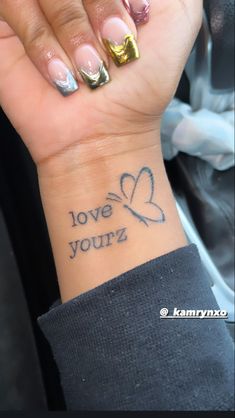 Love yourz tattoo on wrist dainty minimalistic butterfly j Cole song positive quote Butterfly On Wrist, Tattoo With Butterfly, Small Girly Tattoos, Tattoo Wrist, Tattoo Butterfly