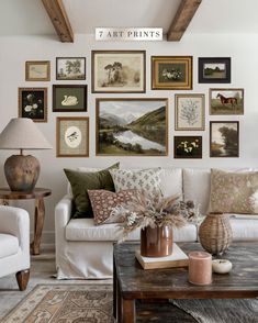 a living room filled with lots of pictures on the wall and furniture in front of it