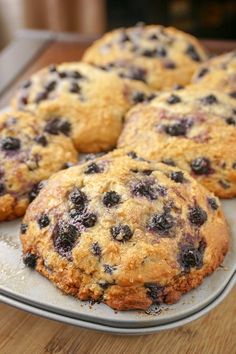 blueberry muffins on a plate ready to be eaten