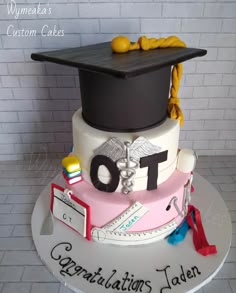 a graduation cake that is on top of a table