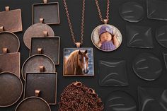 several necklaces and pendants are displayed on a black surface with a horse in the center