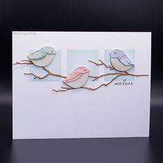 two little birds sitting on a branch with the words love written in it's center