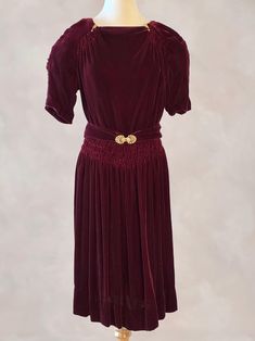 Vintage 40s Dress, 1940s Silk Velvet Burgundy Dress, XS This beautiful 1940's burgundy silk velvet dress is perfect for the holidays.  Bodice has a high square neck, accented with arrow shaped rhinestone clips, and ruching just below the shoulders in the front.  Has short, ruched puffed sleeves, and a wide band of ruching at the waist area.  Closes on the side with a metal zipper, and a single hook and loop at the back of the neckline.  Has a matching silk velvet belt, that closes with a double rhinestone clasp.   Very good, clean condition, with no tears or stains, and the underarms look great.  A few of the seams have been reinforced, and the back of the skirt was hemmed a little shorter than the front.  There are about 6 rhinestones missing from the belt clasps, but are not really notic Velvet Burgundy Dress, 1940s Tea Dress, Vintage 40s Dress, Silk Velvet Dress, Dark Alice In Wonderland, Burgundy Velvet Dress, Velvet Belt, 40s Dress, Ithaca Ny