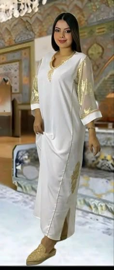 This top quality garndoura, made of silk crepe, zwak lmaalem and Tlija sleeves. This caftan is ideal for family occasions such as family celebrations, the month of Ramadan, Aid, or weddings. Several sizes available, it is possible to have it in a Matchi-Matchi version: mother/daughter. It is also possible to personalize your caftan according to your taste, contact us for more information. Top quality caftan, in silk crepe, with zwak lmaalem. This caftan is ideal for family occasions such as family celebrations, the month of Ramadan, aid, or weddings. Several sizes available, it is possible to have it in Matchi-Matchi version: mom/daughter. It is also possible to customize your caftan according to your taste, contact us for more information Elegant White V-neck Thobe, Elegant Long Sleeve Abaya For Traditional Ceremonies, Festive White Kaftan For Eid, Elegant V-neck Kaftan For Festivals, Elegant Long Sleeve Thobe For Traditional Ceremonies, Festive White Abaya For Eid, Elegant White V-neck Abaya, White V-neck Kaftan For Eid, V-neck Thobe For Eid Festivities