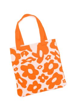 an orange and white animal print tote bag on a white background with the word love