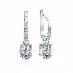 Dangle studs 4-prong basket set diamond earrings make an elegant statement for any occasion. These 14k white gold earrings can last a lifetime. The earrings feature oval-cut natural diamonds with 1.50 ct. total weight for center stone and with 0.10 ct. total weight of small dazzling round-cut diamonds as side stone totaling to 1.60 ct. in a complete pair, available in lever back clasps. Black Diamond Pendant, Black Diamond Studs, Halo Diamond Earrings, Solitaire Diamond Pendant, Colored Diamond Rings, Platinum Earrings, Basket Set, Black Diamond Ring, White Gold Earrings