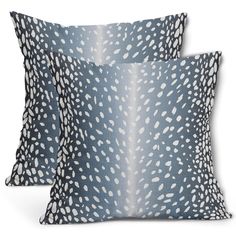 two blue pillows with white spots on them