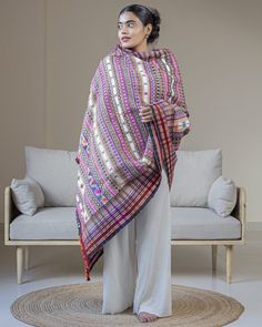 Drape your shoulders in the comforting warmth of traditional Indian artistry with this handwoven shawl from India. Crafted by local artisans from the westernmost frontier of India, this shawl is a symbol of understated luxury, encapsulating the culture and rich history of the region.  The hand-dyed natural fibers and the fineness of the weave don't just promise exceptional softness and resilience but reveal the extraordinary dexterity and skill of the Kutch people. As you run your fingers along Winter Festive Multicolor Dupatta, Festive Multicolor Winter Dupatta, Boho Cape, Handwoven Shawls, Blanket Shawl, Oversized Blanket, Wrap Shawl, Understated Luxury, Shawl Scarf