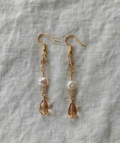 Handcrafted chain earrings made with gold jewelry wire, hypoallergenic gold earring hooks, and beautiful beads including glass gold teardrops and pearl-style beads.  Made with great care and attention to detail, these earrings are elegant and perfect for elevating any outfit for any occasion or event! Named after one of our best friends, Autumn :) Teardrop Bead Jewelry, Fall Inspired Jewelry, Diy Engraved Jewelry, Friends Autumn, Autumn Earrings, Cocktail Earrings, Sweet Jewelry, Fall Earrings, Beaded Drop Earrings