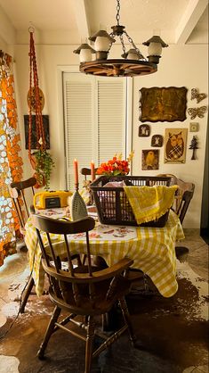 a dining room table covered in yellow and white checkered cloths