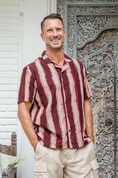 Block-printed by hand with oxblood stripes, Karan Singh's short-sleeved shirt makes a bold impression. Indian artisans craft the casual button-up from cotton, creating the print with dabu , a traditional mud resist process similar to batik. Cotton Top With Vertical Stripes And Camp Collar, Cotton Camp Collar Top With Vertical Stripes, Striped Collared Cotton Camp Shirt, Relaxed Fit Short Sleeve Cotton Shirt With Vertical Stripes, Striped Short Sleeve Cotton Shirt With Relaxed Fit, Striped Cotton Short Sleeve Shirt Relaxed Fit, Cotton Shirt With Vertical Stripes For Summer, Cotton Summer Shirt With Vertical Stripes, Summer Cotton Shirt With Vertical Stripes