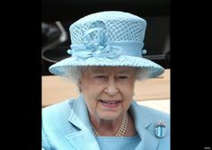 the queen of england is wearing a blue hat