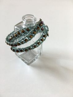 This beautiful blinking and elegant bracelet will be a great addition to your accessories, suitable for casual and evening wear. Perfect gift for every women. Each glass bead is threaded with needle one bead by one. To make this bracelet I use high quality glass beads, polished glass crystals and durable thread. Also have a handwoven toggle closer. If you want a gift wrap, just let me know. It comes in black gift box and tied with riband. Bracelet size: length: fits for 17-19 cm  width: 3 cm To Bohemian Crystal Beaded Bracelets For Jewelry Making, Bohemian Glass Beaded Bracelets For Parties, Elegant Handmade Glass Bracelets, Colorful Crystal Bead Bracelets As Gift, Colorful Crystal Bead Bracelets For Gifts, Colorful Beaded Crystal Bracelets As Gift, Colorful Beaded Crystal Bracelets For Gift, Gift Crystal Bracelets With Colorful Beads, Handmade Green Bangle For Party