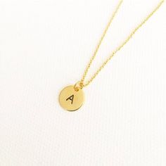 "initial necklace, hand stamped necklace, initial jewellery, personalised necklace, minimalist necklace, monogram necklace, gifts for her \"Less is more\" - Minimalist hand stamped 10mm gold, silver or rose gold plated initial disc - You can choose any letter from initials section to personalize it - Plated chain comes 16inch. Please send me message if you would like it 18inches. This beauty comes inside in a gift box. If your order is a gift, I would be happy to include a personal note for you. Dainty Charm Necklace For Birthday, Gold Name Necklace For Christmas Birthday Gift, Gold-plated Necklaces For Birthday, Dainty Hand Stamped Yellow Gold Necklaces, Dainty Hand Stamped Yellow Gold Necklace, Dainty Hand-stamped Yellow Gold Necklace, Dainty Initial Necklace With Charms For Gift, Gold Initial Necklace With Delicate Chain For Personalized Gift, Dainty Hand Stamped Initial Necklace For Gift