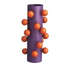 a purple vase with orange balls on it