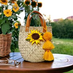 Each bag is handcrafted with care and attention to detail by skilled artisans using traditional techniques.  These all-natural baskets are made from palm leaves, and and dyed with beautiful traditional designs. Since each basket is handmade.  The addition of genuine leather straps adds durabilit. Pompom included Handmade Yellow Straw Summer Bag, Handmade Yellow Straw Bag For Summer, Handmade Yellow Summer Straw Bag, Yellow Handmade Straw Bag For Daily Use, Artisan Bucket Bag With Braided Handles In Natural Color, Artisan Natural Bucket Bag With Braided Handles, Handmade Yellow Straw Bag For Daily Use, Handmade Natural Fiber Bucket Bag, Handmade Basket Bucket Bag For Vacation