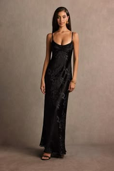 Our Ivy Maxi Dress is the perfect go-to dress when it comes to evening wear. This beautiful primrose satin burnout style features a flattering cowl neckline and a floor-length sheath silhouette. Wear this dress to your next formal affair. Blaxk Maxi Dress, Formal Sparkly Dresses, A Symmetrical Dress, New Years Eve Wedding Guest Dress Cocktail, Black Silk Floor Length Dress, Long Formal Dresses Classy, Black Dress Business, Long Sleek Black Dress, Classy Black Tie Dress