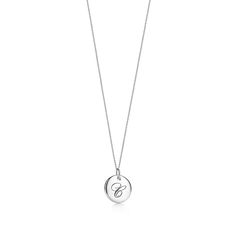 Inspired by handwritten notes, this sterling silver pendant is engraved with an elegant script letter. The perfect gift for you or someone special, Tiffany Notes pendants are beautiful on their own or styled together. Every jewelry collection needs a meaningful, personal necklace. Sterling silver; .5" diameter; On a 16" chain | Tiffany Notes Letter C Round Pendant in Sterling Silver Tiffanys Necklace, Bridal Jewelry Necklace, Tiffany Necklace, Round Pendant Necklace, Handwritten Notes, Me And Him, Engraved Items, Round Pendant, Necklace Sterling Silver