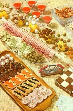 an assortment of food is displayed on a table