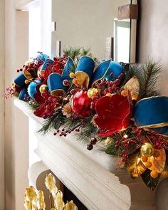 a decorated fireplace mantel with blue and red hats