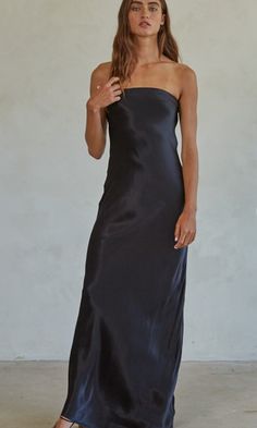 Eden's 6th Day Strapless Black Satin Bias Cut Maxi Dress, Side Zip Rayon and Poly Satin Machine Wash Gentle, Cool Water, Line Dry Satin Strapless Dress With Fitted Bodice For Night Out, Fitted Strapless Slip Dress For Dinner, Satin Slip Dress With Straight Neckline For Date Night, Black Sleeveless Satin Cocktail Dress, Black Sleeveless Dress With Satin Finish, Silk Fitted Strapless Dress With Straight Neckline, Black Satin Midi Dress With Spaghetti Straps, Satin Slip Dress For Night Out With Straight Neckline, Satin Slip Dress With Straight Neckline For Night Out