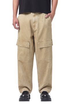 Roomy and relaxed, these cargo pants cut from soft cotton twill feature light fading and plenty of roomy pockets for holding a day's essentials. 29 1/2" inseam; 20" leg opening; 13 1/2" front rise; 16 1/2 back rise (size 29) Zip fly with button closure Front slant pockets; back flap-patch pockets; cargo flap-patch pockets 100% cotton Machine wash, tumble dry Made in the USA of imported fabric Utility Straight Cargo Pants For Elevated Casual, Elevated Casual Utility Jeans With Cargo Pockets, Beige Relaxed Fit Cargo Pants For Streetwear, Utility Pants With Pockets For Elevated Casual, Utility Pants With Pockets For Elevated Casual Occasions, Urban Beige Cotton Cargo Pants, Smart Casual Wide Leg Cotton Cargo Pants, Wide Leg Cotton Cargo Pants For Elevated Casual Wear, Tapered Leg Cotton Cargo Jeans