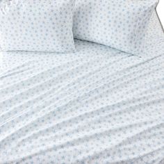 a bed with blue and white stars on it