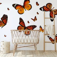 a wall with many orange butterflies flying in the air and on it's side