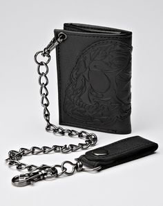 You'll have some badass style and ultimate organization when you use this skull chain wallet. Keep your cash and your cards safe and secure all day long! Snap closure Dimensions: 5" H x 4" W Material: Polyurethane Care: Spot clean Imported Black Wallet Men, Country Boy Outfits, Spencers Gifts, Country Boy, Badass Style, Outfit For Men, Keychain Wallet, Chain Wallet, Black Wallet