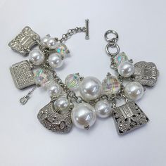 Pearl charm bracelet, allow 2-3 business days for delivery. Trendy Silver Jewelry With Pearl Charm, Elegant Dangle Charm Bracelet With Vintage Charm, Elegant Charm Bracelet With Vintage Dangle Charms, Elegant Jewelry With Removable Dangle Charms, Elegant Dangle Bracelets With Vintage Charm, Elegant Vintage Charm Dangle Bracelets, Elegant Vintage Charm Dangle Bracelet, Everyday Charm Bangle Bracelet, Trendy Metal Jewelry With Vintage Charm