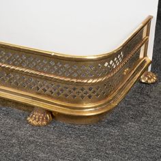 an ornate gold metal bed frame on carpeted floor