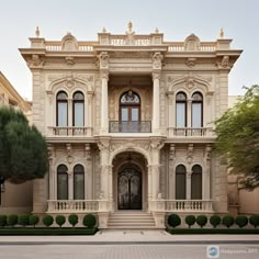 an ornately designed house with large windows and balconies