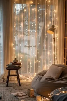 a bedroom with lights on the curtains and a bed