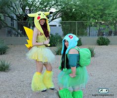 two women dressed up as pokemon and pikachu in front of a fenced area