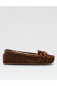 Suede upper with pile lining/Foam EVA midsole/Rubber outsole/Rawhide lacing/Lightweight sole/Not eligible for promotions | Only ships within the USA Moccasin Shoes, Minnetonka Moccasins, Jeans Accessories, Shoes To Buy, Cozy Day, Slide Slippers, Free Jeans, Sale Clothing, Fuzzy Slippers