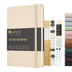 an image of a notebook with different colored papers on it and the cover is open