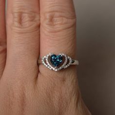 This is a gorgeous handmade creation. Its beauty is its simplicity & Elegance. The 6*6 mm heart cut faceted real London blue topaz is crafted in solid sterling silver and with rhodium plated. All item is sent in a beautiful gift box If you have any idea of design your ring,pls contact me directly. You can realize more lovely stuff clicking the link https://www.etsy.com/shop/knightjewelry?refshopsection_shophome_leftnav Please leave the correct address and you phone number for delivering succ Sterling Silver Heart-shaped Diamond Cut Rings, Heart Shaped Diamond Cut Sterling Silver Ring, Heart Shaped Sterling Silver Rings With Diamond Cut, Heart-shaped Blue Topaz Birthstone Jewelry, Heart-shaped Sterling Silver Rings With Diamond Cut, Heart-shaped Blue Topaz Jewelry For Weddings, Heart Cut Topaz Jewelry For Anniversary, Heart Cut Blue Topaz Birthstone Jewelry, Sterling Silver Diamond Cut Topaz Promise Ring