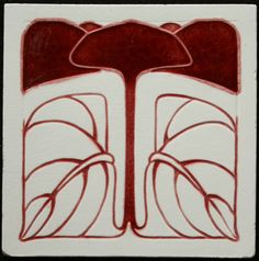 a red and white card with an abstract design on the front, featuring two leaves