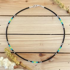 The Lagoon beaded choker highlights a beautiful blue to green ombre accented with just a splash of white. All chokers are customizable to the size you need so please be sure to measure your neck where you want your choker to sit and order accordingly! This high quality beaded choker is beautiful worn on its own or layered. It is secured with a sterling silver lobster claw and made with glass beads that can stand the test of time, making it perfect for everyday use. To aid in the longevity of thi Aztec Beaded Necklace, Trendy Diy Jewelry Necklaces, Cute Western Beaded Necklaces, Aztec Beading Patterns, Bead Necklace Color Combos, Beachy Necklaces Beads, Diy Seed Bead Necklace, Beaded Chocker Ideas, Beaded Choker Ideas