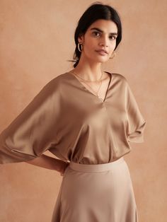 Dolman-Sleeve V-Neck Top | Banana Republic Factory Modern Solid Color V-neck Tops, Sleek V-neck Tops For Office, Sleek Solid Color V-neck Top, Sleek Solid V-neck Blouse, Sleek Solid V-neck Top, French Chic Fashion, Women Ruffle Blouse, Printed Sleeveless Blouse, Top Banana