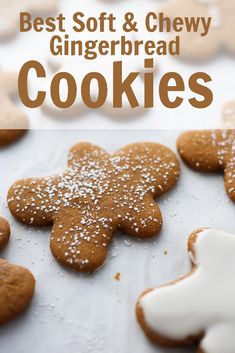 gingerbread cookies with icing and powdered sugar are arranged on a baking sheet