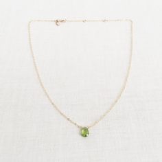 "This is a peridot necklace made of genuine high quality faceted peridot. There are gold filled ,sterling silver and 14kt gold chain you can choose from. Each necklace has 2\" extender. There are 2 sizes that you can choose from 14\"-16\" and 16\"- 18\" in gold filled or sterling silver. 14k gold necklace will be in single size without extender.This is a August birthstone necklace. Peridot jewelry is light weight and elegant. This green peridot is around 1 carats. The green stone necklace is gre Green Peridot Necklace For May Birthstone, Lime Green Peridot Necklace For May Birthstone, Green Peridot Gemstone Necklace, Oval Peridot Necklace For May Birthstone, Oval Green Peridot Necklaces, Green Peridot Pendant Necklace, Lime Green Necklace For May Birthstone Gift, Lime Green Necklace Gift For May Birthstone, Peridot Gemstone Pendant Necklace