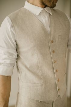 "Each linen waistcoat is handcrafted to fit individual body measurements. We take pride in the fact that there are no factory processes involved in making our linen clothes. Each linen vest is made with care and attention to detail. DESCRIPTION. This linen waistcoat is a modern yet ethno-inspired and exceptional gift, who will enhance the personal style of man with its timeless charm. The vest is made from two linen layers, so it will keep its form and still allow your skin to breathe easily. It Luxury Cotton Men's Vest, Mens Elopement Vest, Boho Wedding Mens Vest, Groom Vest Vintage, Wedding Vest Groom, Linen Outfit For Men Wedding Attire, Linen Waistcoat Men, Linen Formal Dress, Linen Clothes For Men