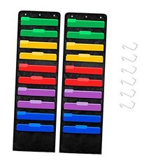 two large black folders with colored dividers on each side and one smaller colorful file holder in the middle