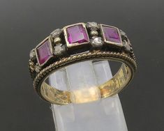 14K GOLD - Vintage Old Cut Diamonds & Amethyst Twist Band Ring Sz 9 - GR154  Jewelry Type:         Ring  Metal Type:            14k Gold   Metal Size:             9 Finger  Stone Type:            Diamonds & Amethyst   Condition:              N/A  Jewelry Weight:     5.8 Grams  PLEASE NOTE: THIS ITEM IS PRE-OWNED. ALTHOUGH MOST ITEMS ARE IN VERY GOOD CONDITION, SOME MAY NEED CLEANING AND/OR MINOR REPAIRS. WE MAKE A VERY STRONG EFFORT TO UPLOAD CLEAR PICTURES. PLEASE INSPECT ALL PICTURES AND ASK ALL QUESTIONS YOU MAY HAVE PRIOR TO MAKING A PURCHASE. NOT ALL STONES ARE GENUINE, SOME ARE ENHANCED OR CREATED. Gold Heirloom Ruby Ring With Gemstone Accents, Heirloom Gold Ruby Ring With Gemstone Accents, Gold Amethyst Rings With Rose Cut Diamonds, Victorian Wedding Jewelry With Gemstone Accents, Antique Ruby Ring Jewelry, Collectible Gold Jewelry With Gemstone Accents, Antique Wedding Jewelry With Gemstone Accents, Antique Jewelry With Gemstone Accents For Wedding, Victorian Ruby Ring Jewelry